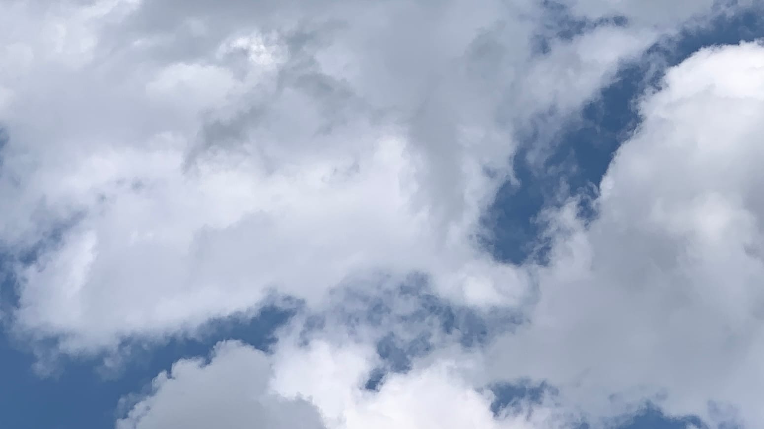 White semi-puffy clouds with nice blue peeking through