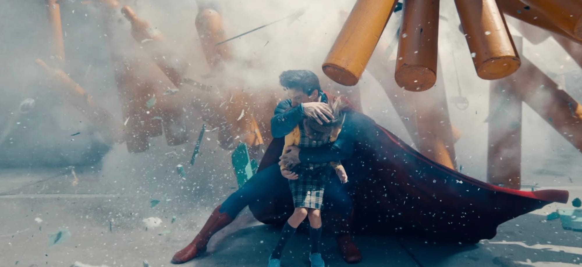 Superman saving a child from certain death as he uses his body and cape as a shield from a shitstorm of debris and a bunch of big gas canisters hurtling through the air.