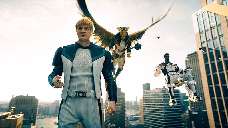 The bad bowl-haircutted Green Lantern Guy Gardner, Hawkgirl, and Mr. Terrific all in midair
