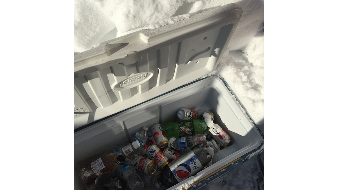 Fully-stocked beverage cooler that was buried under the snow.