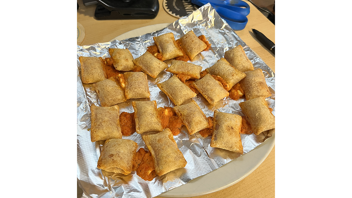 Fully-cooked rolls on foil now on a plate