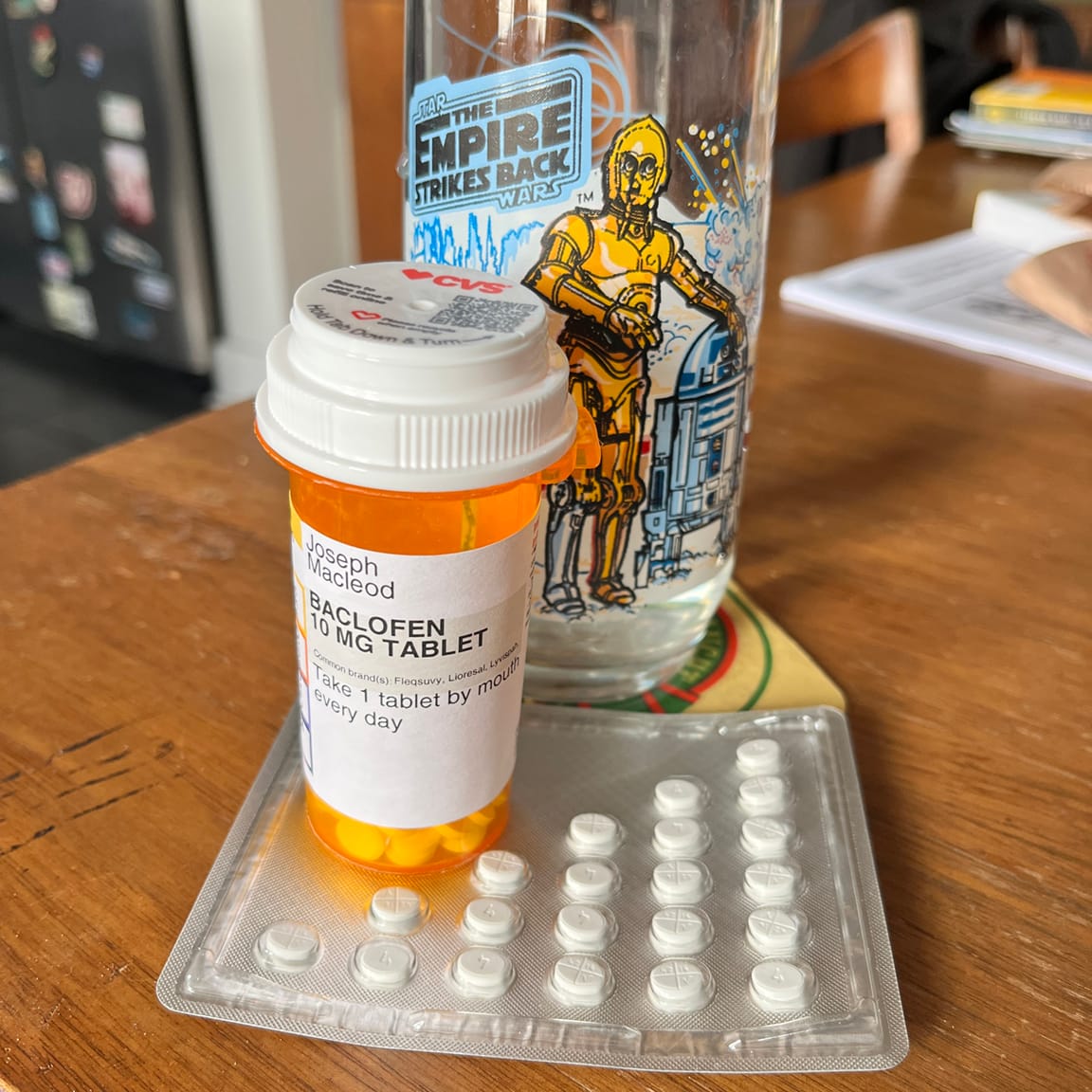 All my pills, my BACLOFEN, my MethylPREDNISolone, and my Burger King STAR WARS glass with the robots on it
