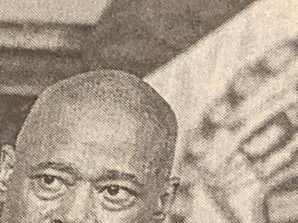 Detail of photo in the print edition of the New York Times, portion of the head of Eric Adams
