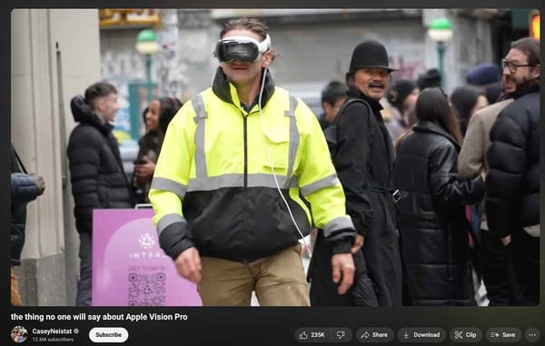 Casey Niestat on sidewalk and a couple of people are looking at him laughing because he's wearing the goofy goggles